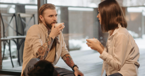 Couple having a heart to heart with coffee